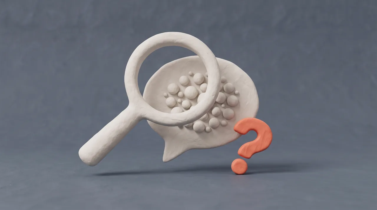 Clay render: a magnifying glass over a message bubble filled with small dots, next to a coral question mark.